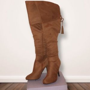 Brown heeled knee high boots